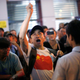 An anti-Occupy Central protester argues with pro-democracy protesters on a main street at Hong Kong